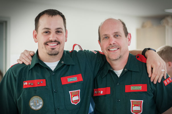 Brigade Leaders offering discipleship wearing green and red uniforms with unit bages